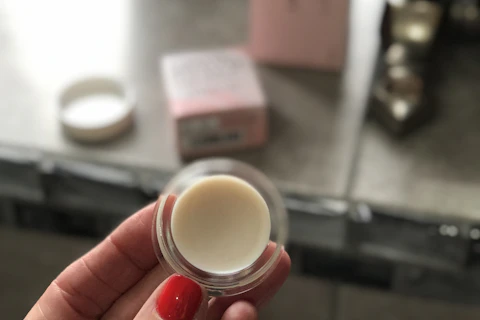 A cosmetic ointment jar illustrating petroleum jelly applications