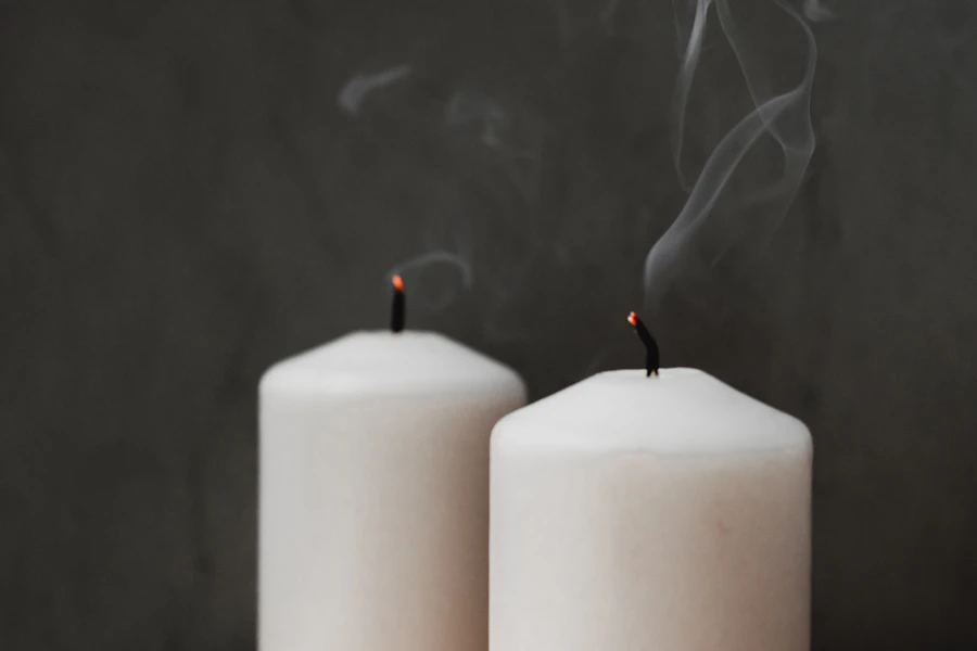 White pillar candles illustrating paraffin wax applications