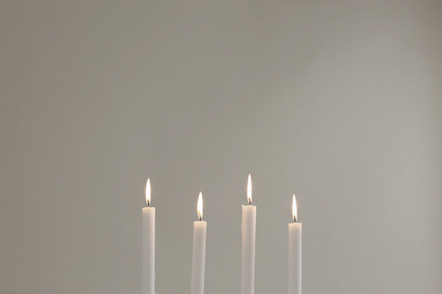 White taper candles illustrating wax applications